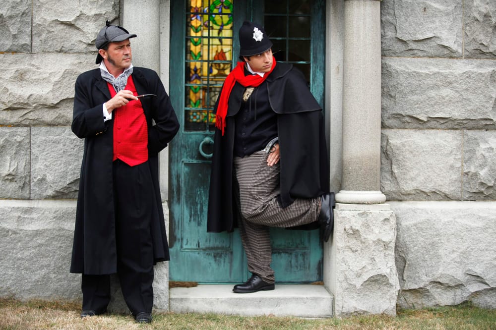 Two characters in period costume beside a stained-glass door