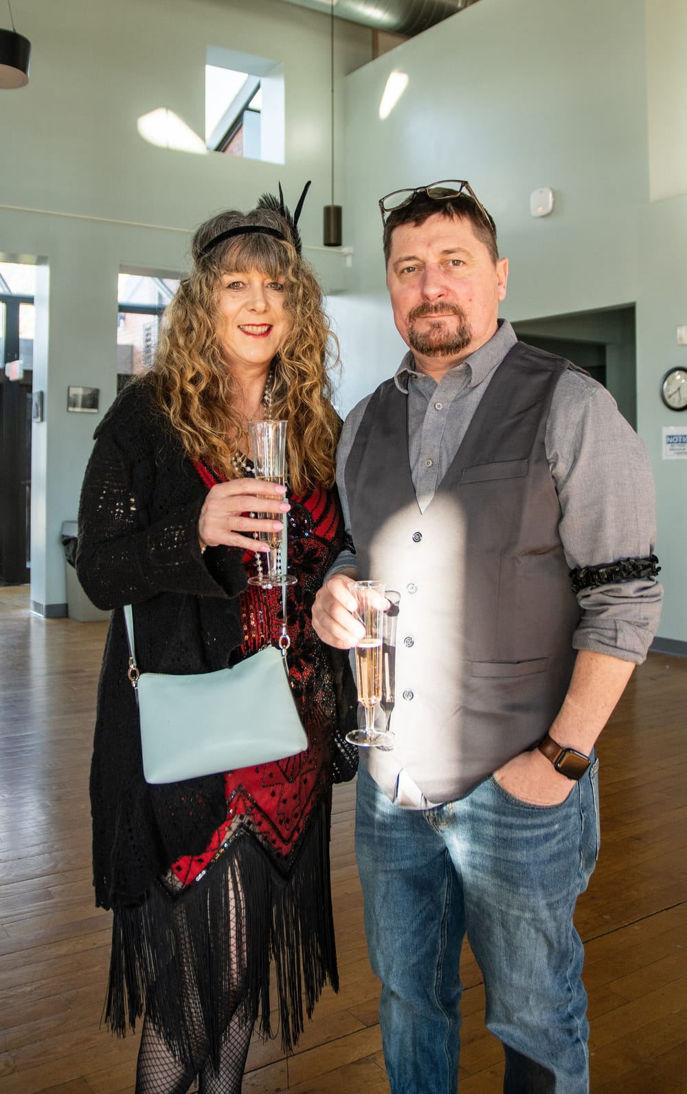 Guests in period dress with champagne