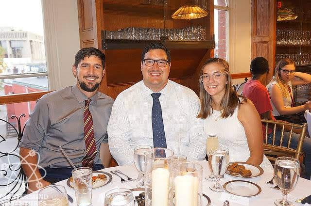 A toast at the alumni dinner