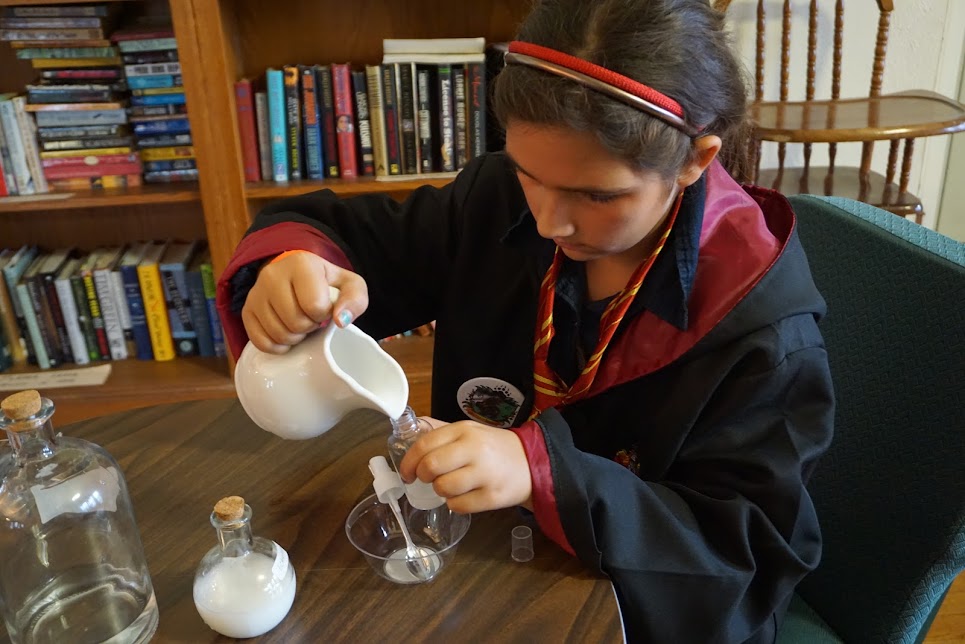 Student focused on potions experiment