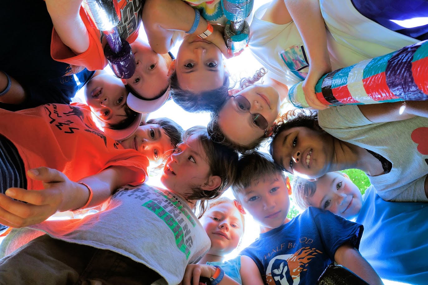 Diverse group of campers in team circle